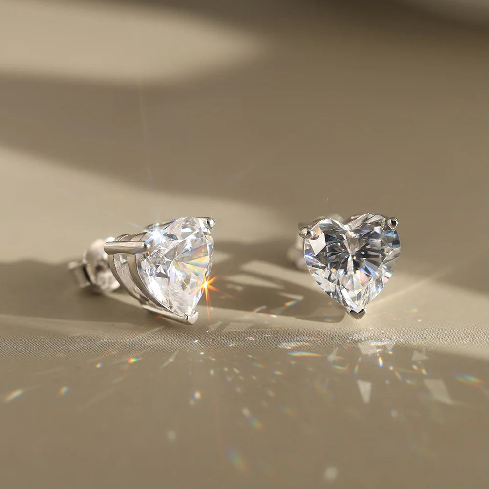 Heart-shaped moissanite-style studs, listed 0.5–4 ct