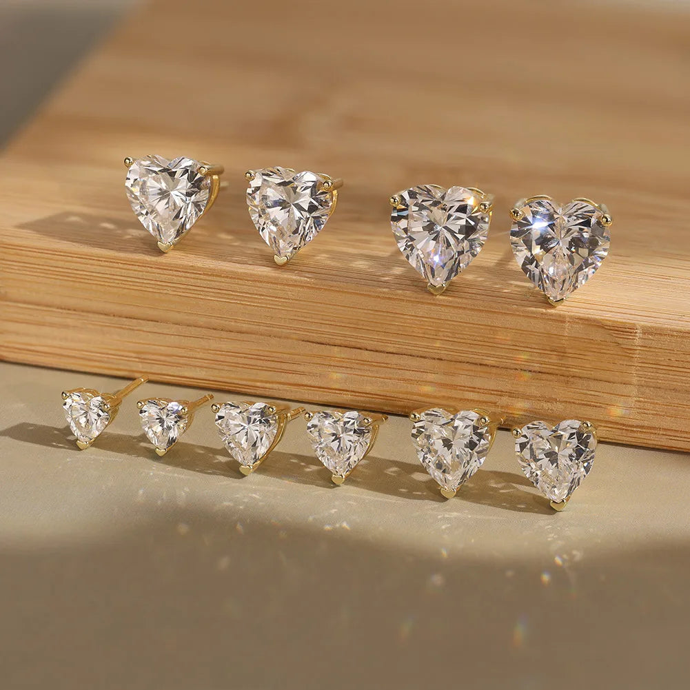 Heart-shaped moissanite-style studs, listed 0.5–4 ct